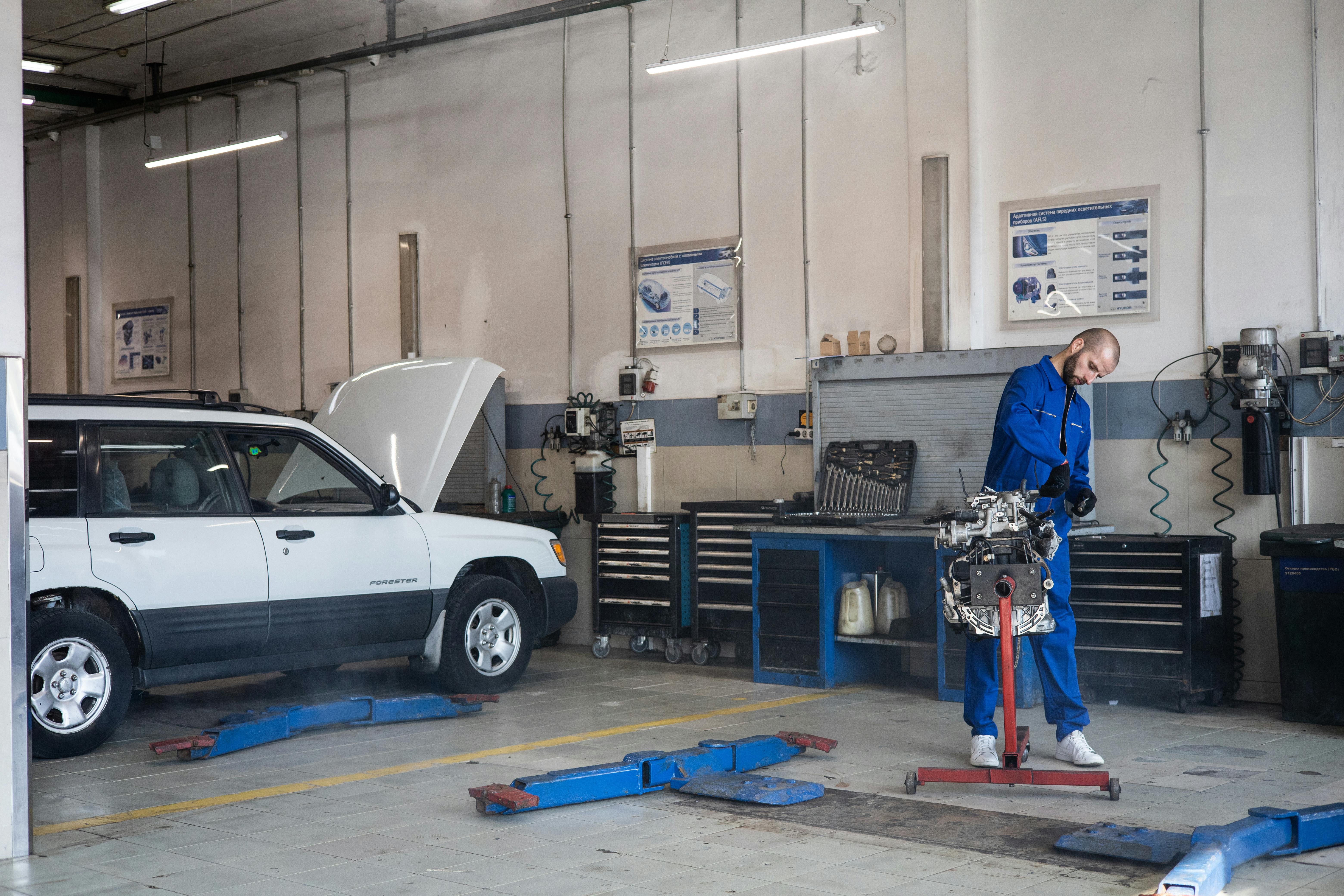 Auto mechanic working in a service workshop
