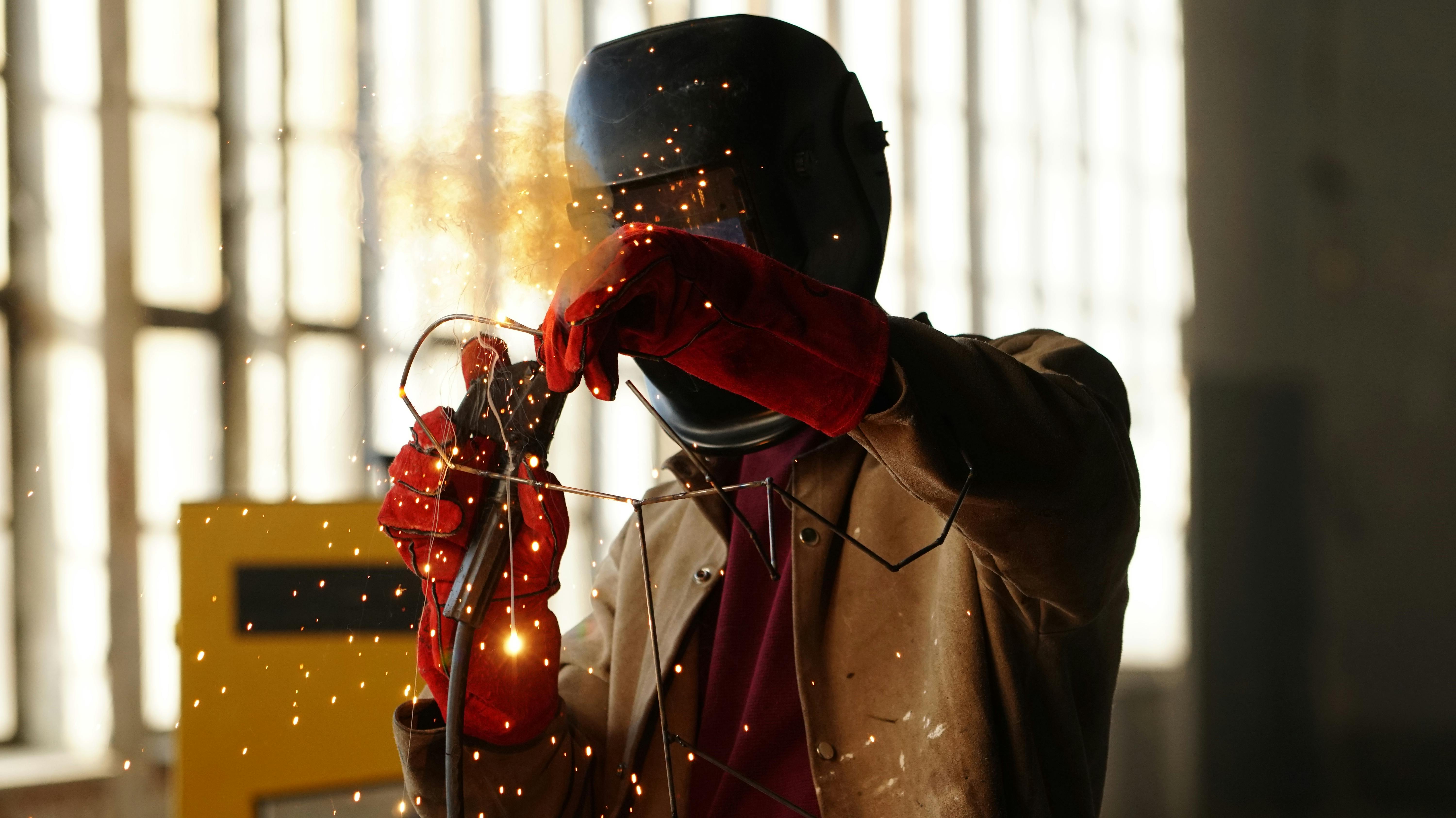 Industrial welder in protective gear